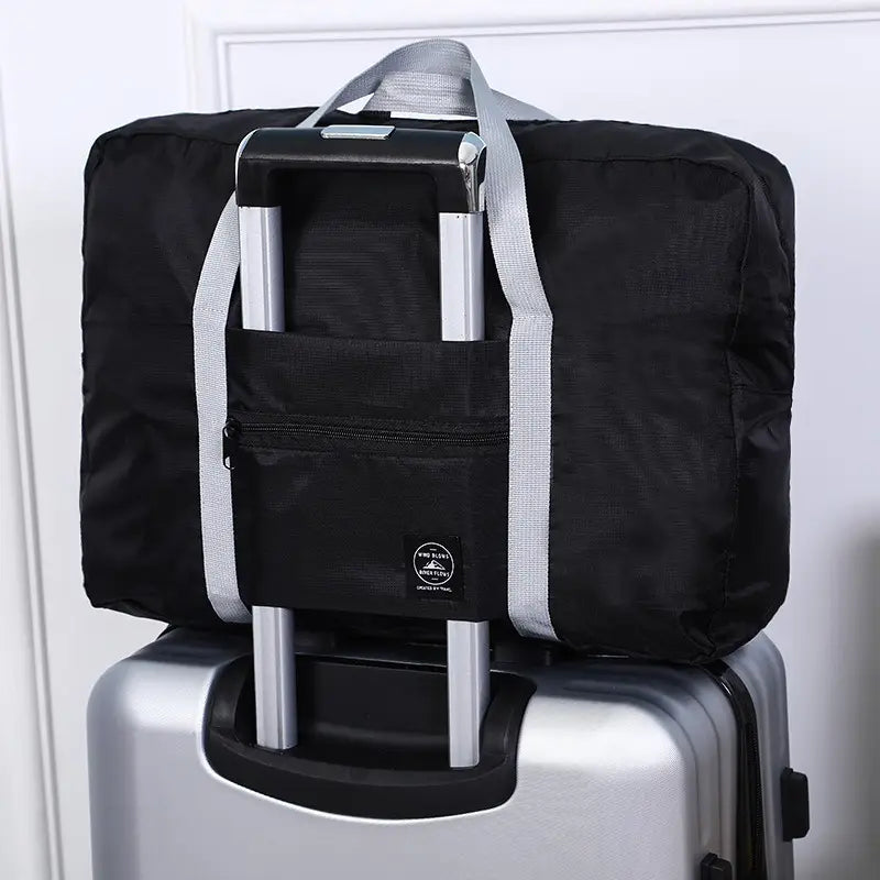 BOLSO DE VIAJE PEGABLE DE MALETA